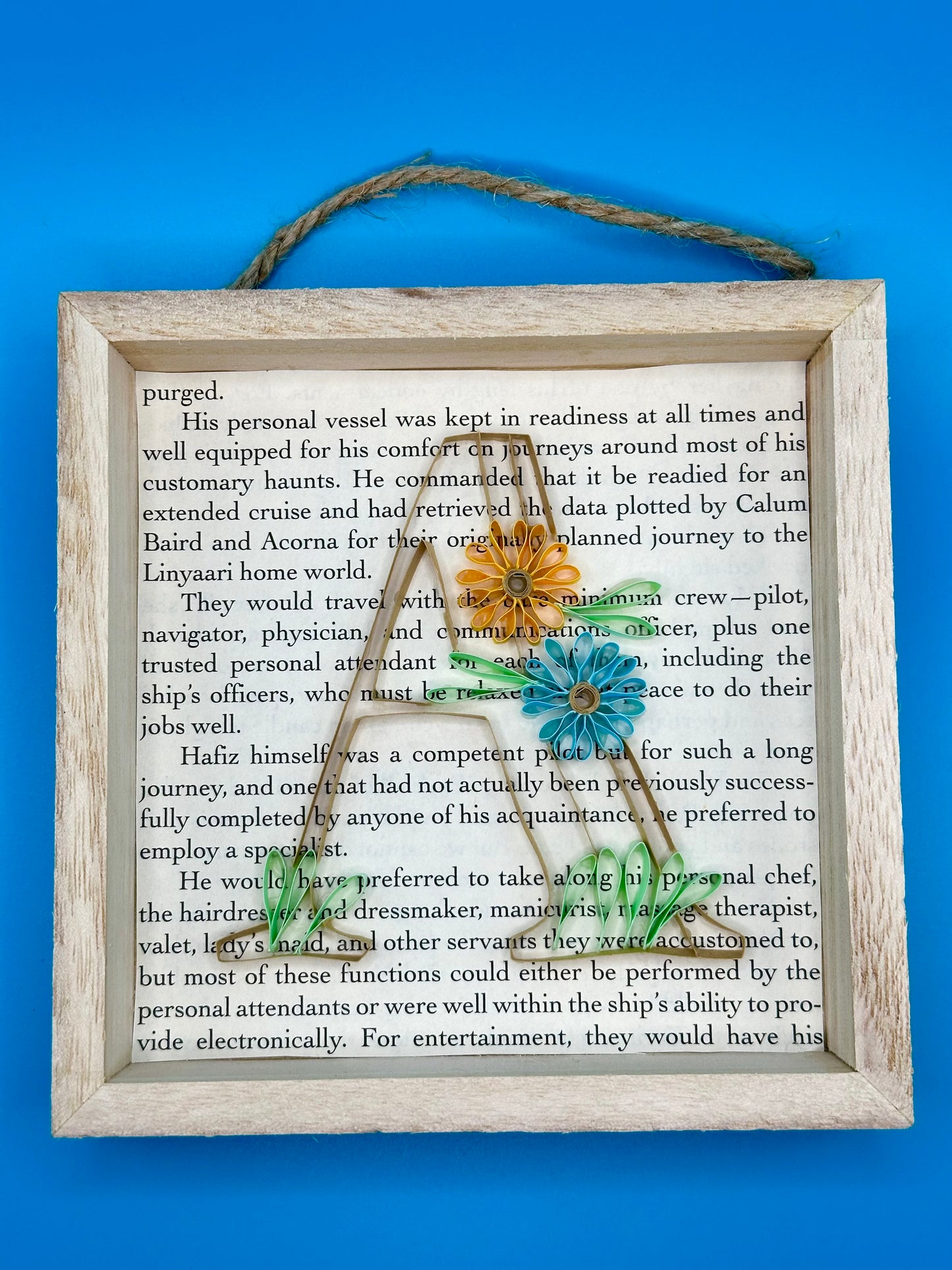 Picture of a quilling letter A with a floral theme