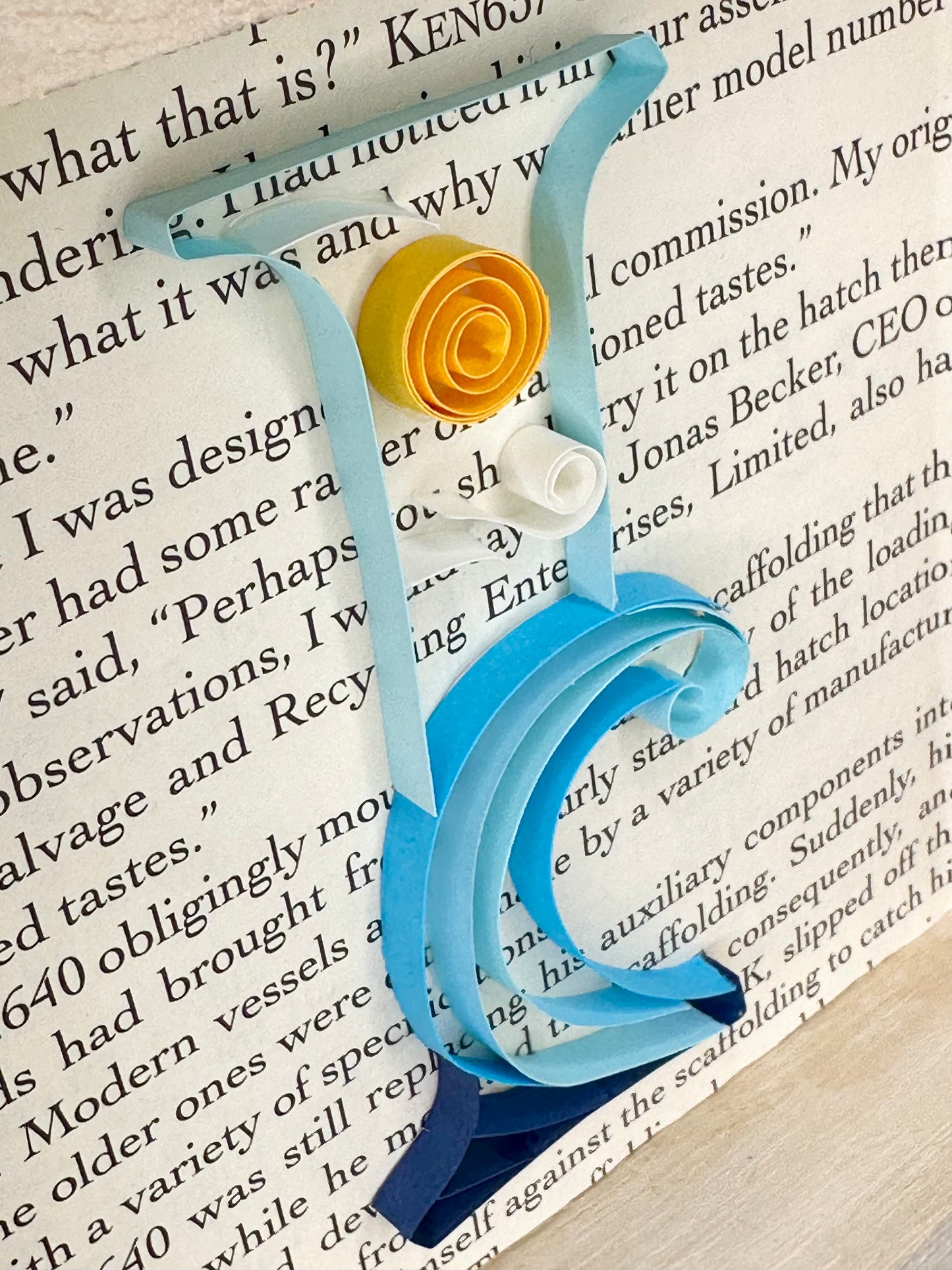 Close up detail of waves themed quilling