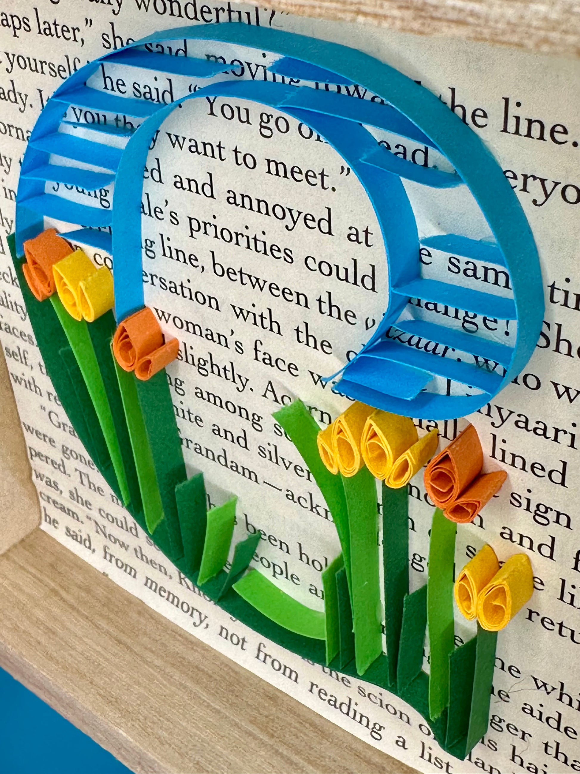 Handmade quilling art with flowers