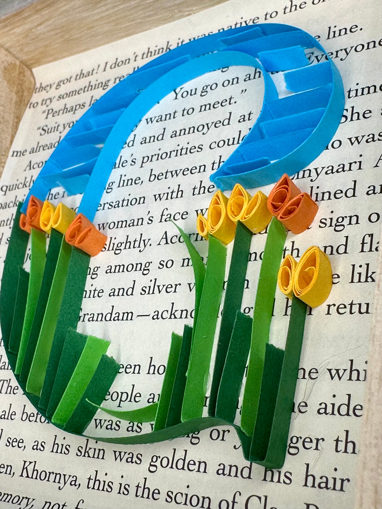 Quilling letter G with a floral design