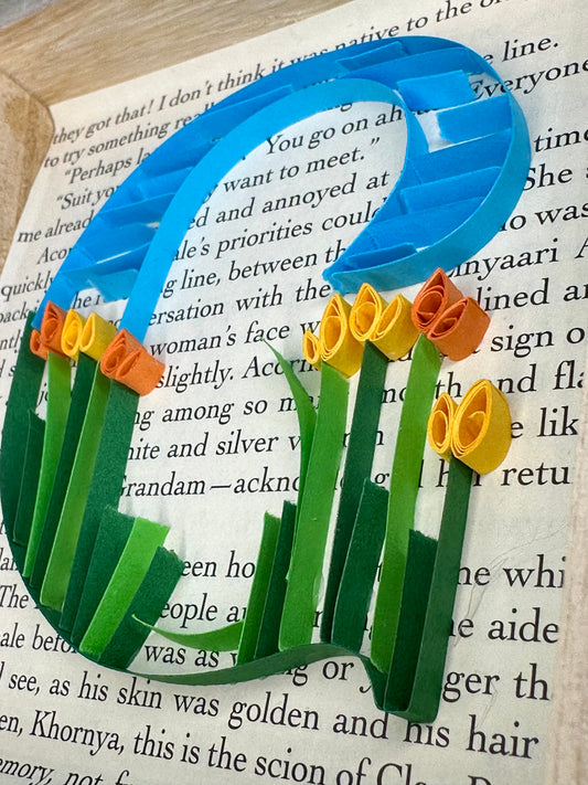 Quilling letter G with a floral design