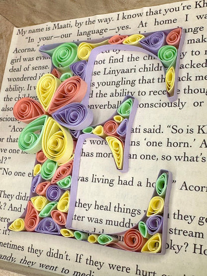 Handmade quilling letter E art