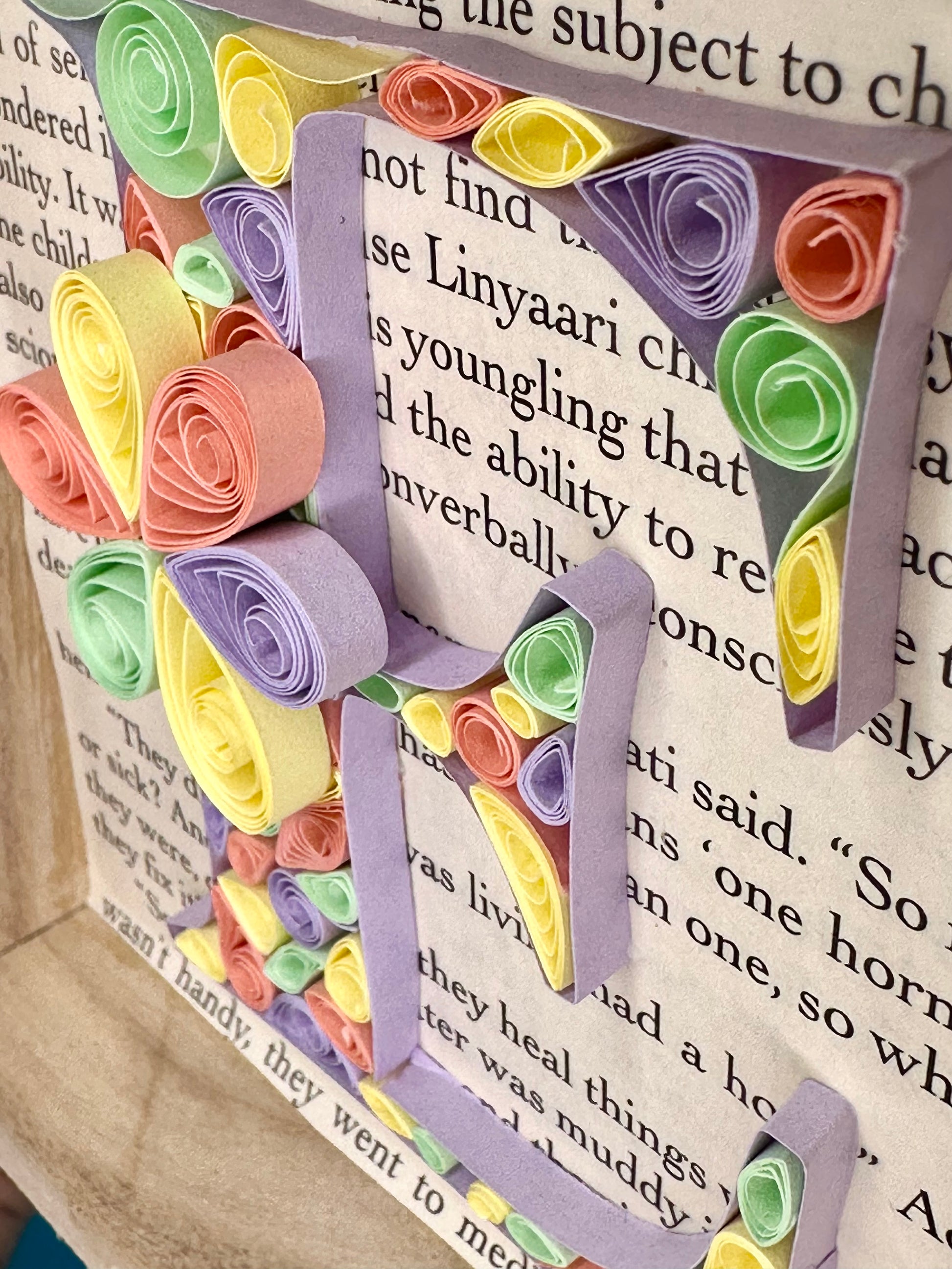 Close up of abstract quilling letter E