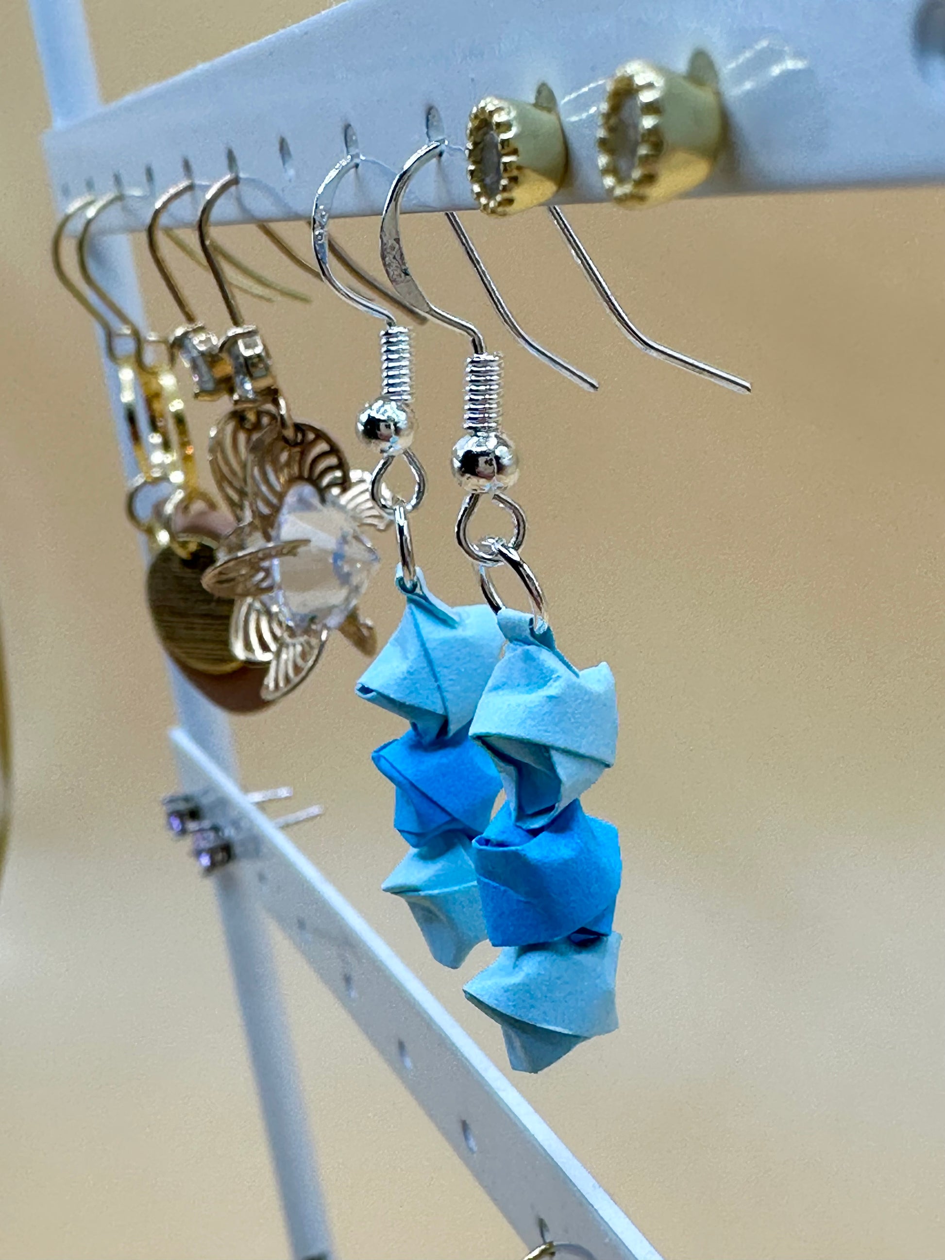 Detail of blue origami quilling earrings